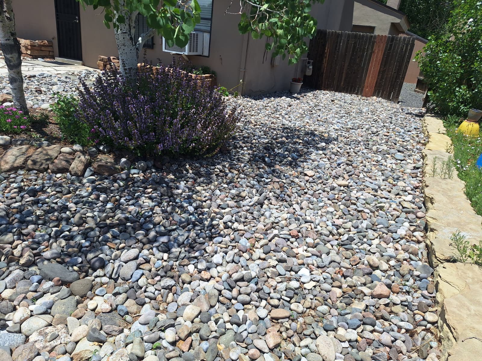 River rock xeriscape with native lavender plants – Santa Fe